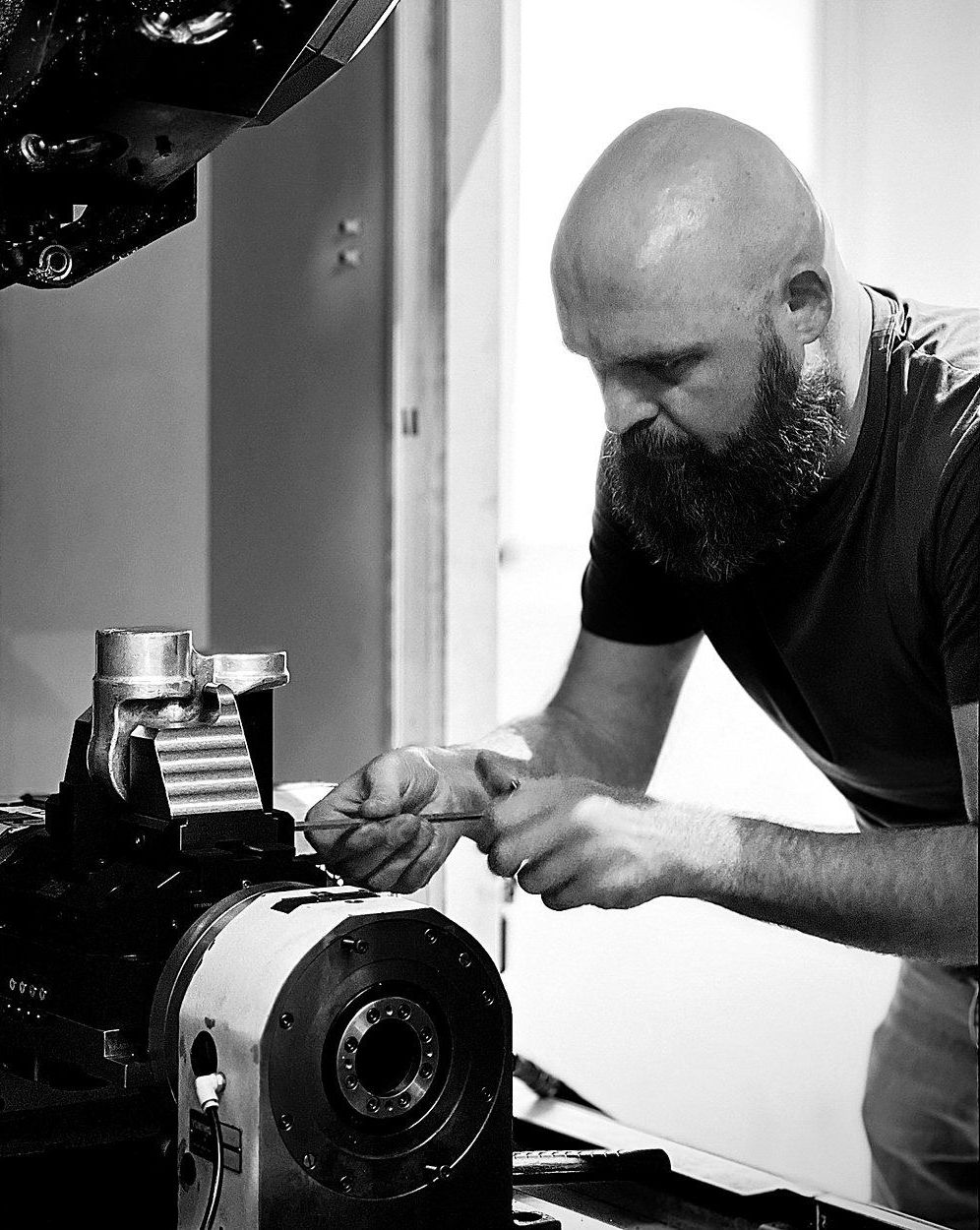 Matthias Hodel setting up a part on a 5-axis rotary table