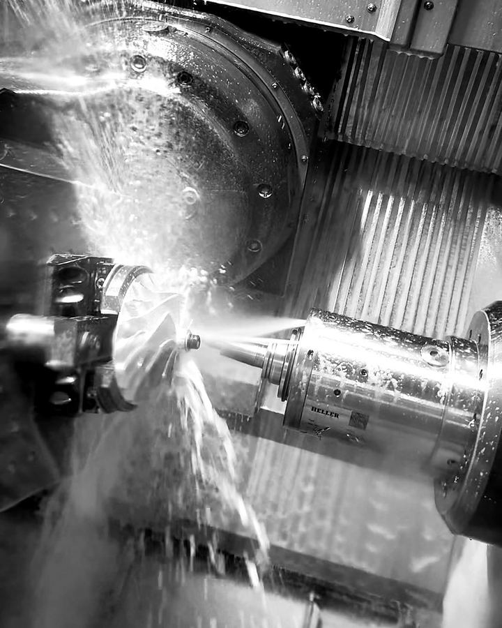 Impeller being machined under coolant on a 5-axis machine